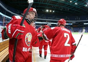 HELSINKI, FINLAND - DECEMBER 27: Alexei Patsenkin #6 of Belarus celebrating at the bench with Alexander Tabolin #2 during preliminary round action against Slovakia at the 2016 IIHF World Junior Championship. (Photo by Andre Ringuette/HHOF-IIHF Images)

