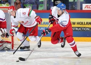 HELSINKI, FINLAND - DECEMBER 30: Jakub Zboril #20 of the Czech Republic skates with the puck while Grigori Veremyov #15 of Belarus chases him down during preliminary round action at the 2016 IIHF World Junior Championship. (Photo by Andre Ringuette/HHOF-IIHF Images)

